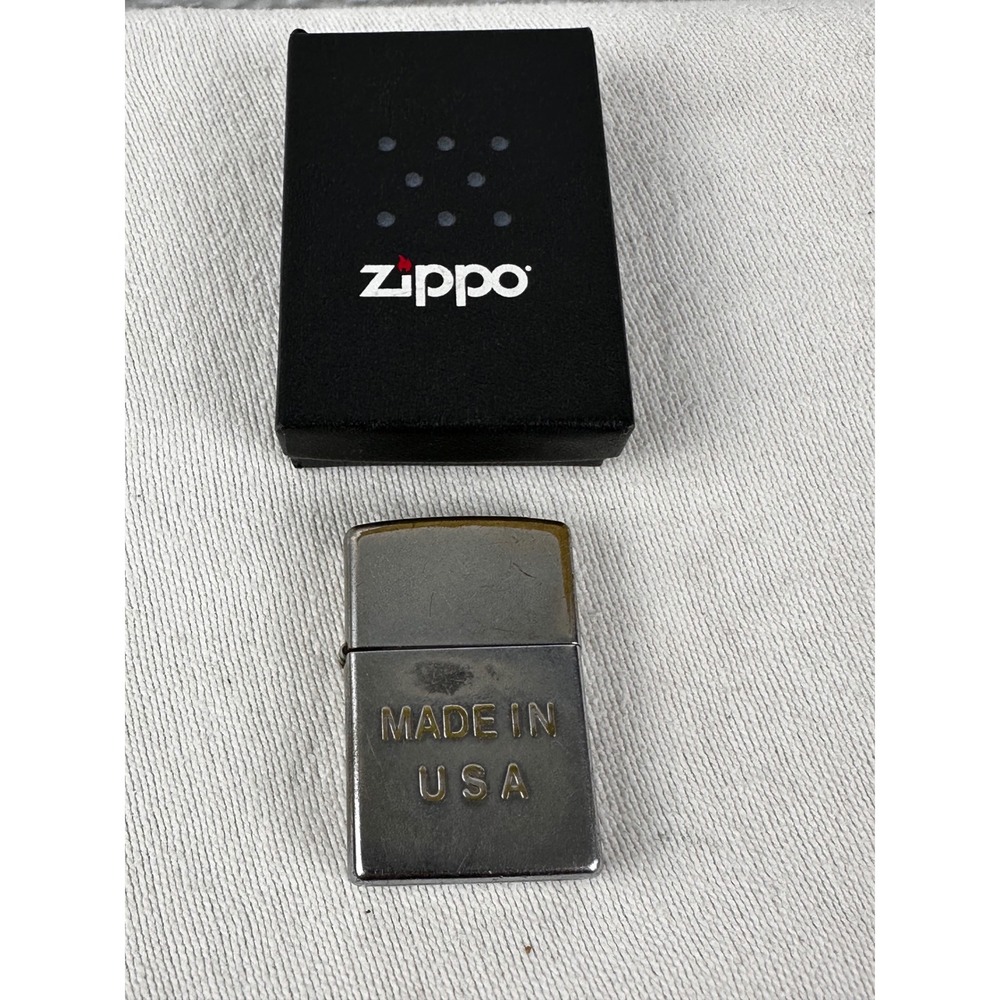 Vintage Zippo lighter‎ Made in USA on front.